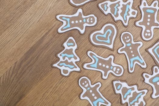 Variety of gingerbread cookies on a wooden table