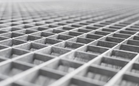 Angle metal lattice background with shallow DOF and selective focus point on small cells of grid