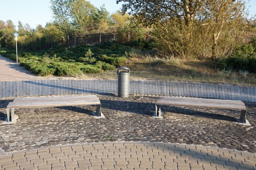 A park with a wooden path and benches