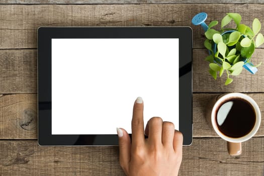 hand using tablet on top view