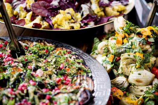 Close up image of assorted salads in buffet