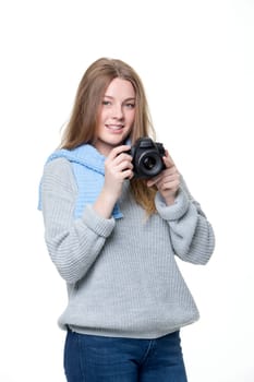Teenage girl taking a photo with a camera