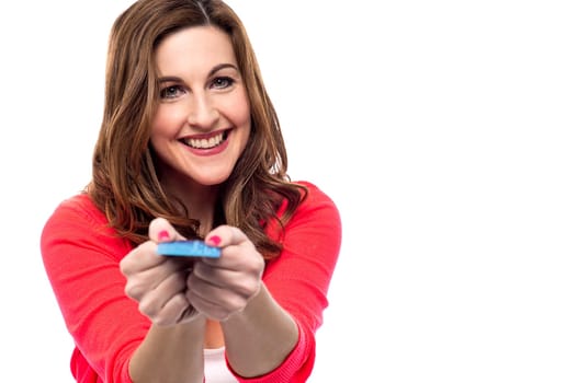 Attractive woman showing credit card