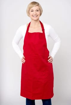 Woman ready for cooking, wearing apron