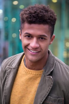 Portrait of an attractive, young, mixed-race man in the city