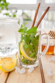 Cup of fresh tea with mint and lemon