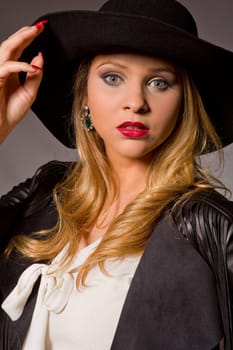 fashion young woman on a grey background