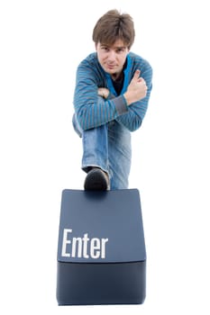 young casual man with the enter key