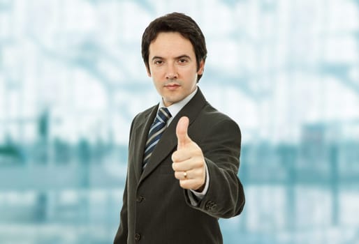 young business man going thumb up at the office
