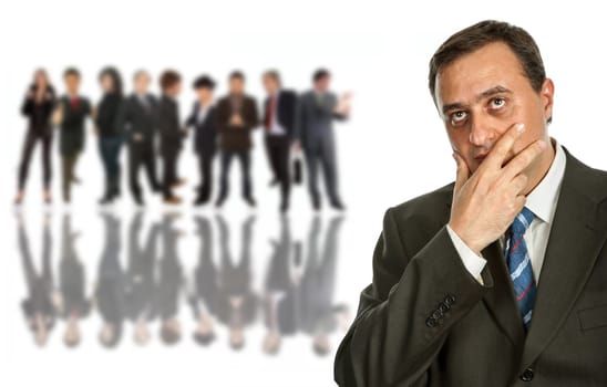 young pensive business man in front of a group of people