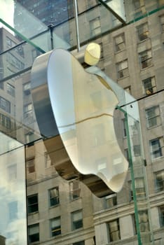 New York City - 9 June  Apple Sore in New York City on Fifth Avenue in June 9 2015, USA. The Store in it self is alla underground except for the 32 - foot glass cube sight in front of the GM building.