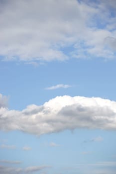 A beautiful light blue sky with white clouds.
