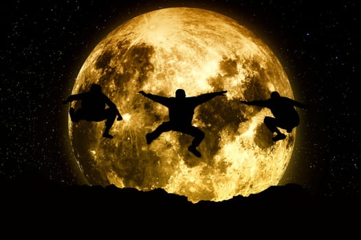 Three friends jumping on a moon background