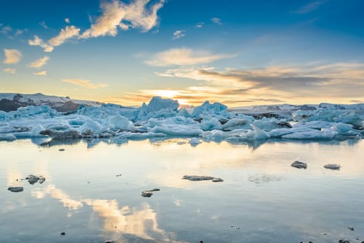 Scenic view of icebergs in Jokulsarlon glacier lagoon, Iceland, at sunset, selective focus