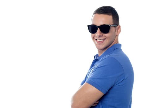 Charming guy in shades, posing sideways.