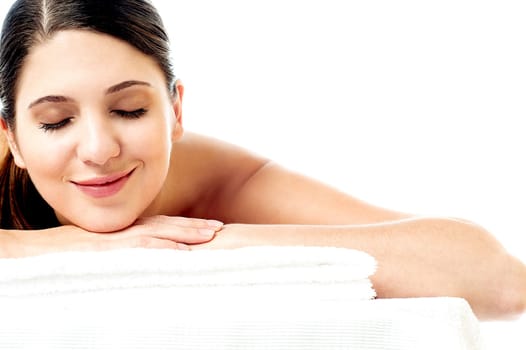 Young woman enjoying her spa