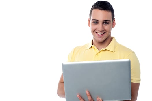Teenager guy holding laptop
