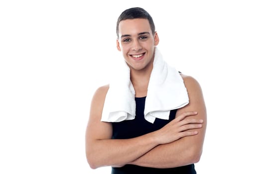 Muscular boy posing with towel around neck
