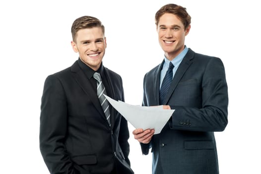 Two businessmen analysing the reports