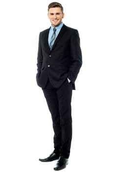 Businessman posing stylishly on white background