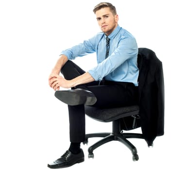 Young man sitting on a revolving chair