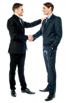 Cheerful entrepreneurs shaking hands
