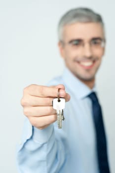 Businessman offering keys