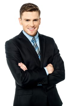 Charming young executive, arms crossed.