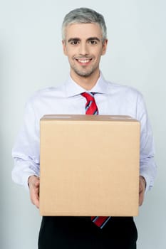 Young executive holding a parcel