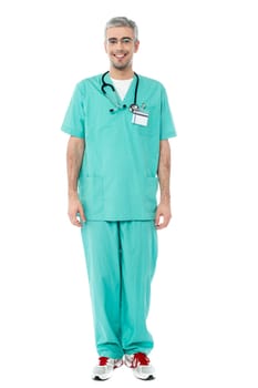 Young male doctor isolated on white