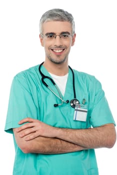 Young doctor posing with folded arms