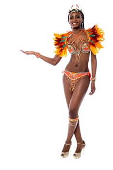 Female samba dancer giving a pose, legs crossed.