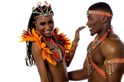 Samba dancers posing against white background