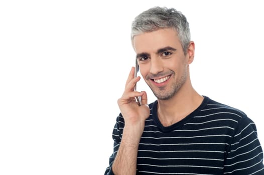 Handsome man talking on the cell phone