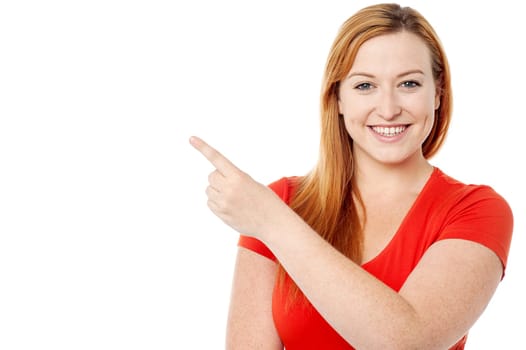 Caucasian female pointing away