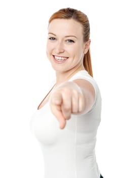 Happy young woman pointing you out