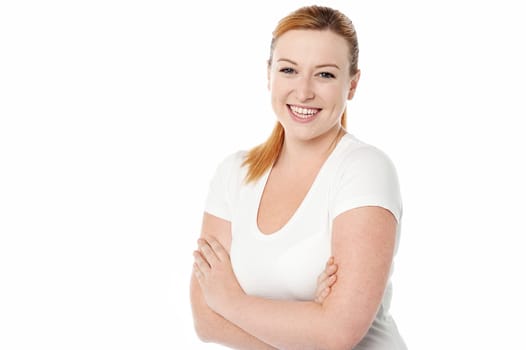 Young smiling lady posing over white