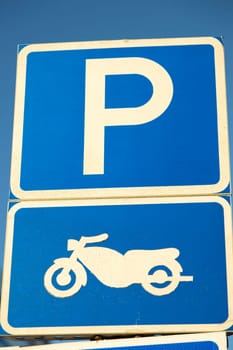 Motorbike Parking Sign with clear blue sky. Swedish.