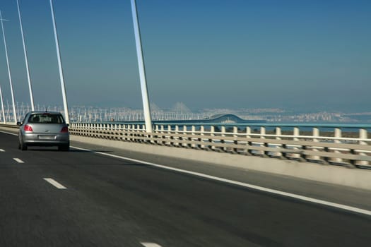 Driving along car the Vasco da Gama Bridge, the the longest one in Europe