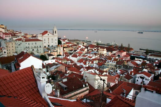 Alfama district from the miradouro viewpoint in the central Lisbon at dusk, Portugal