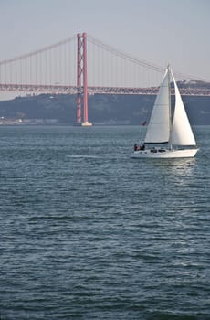 Sailing on the river Tagus with the 25 Abril bridge at the bottom, Lisbon, Portugal