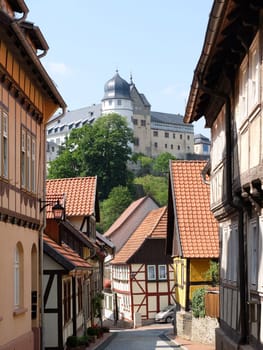 Alley in Stolberg with a view of the castle