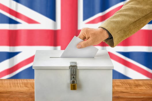 Man throws ballot papers into ballot box - UK