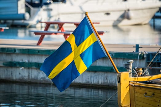 Sweden flag on a boat in a harbor