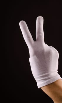 Male hand with white gloves counting