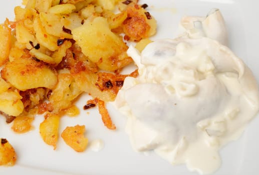 Herring in sour cream sauce with roasted potatoes