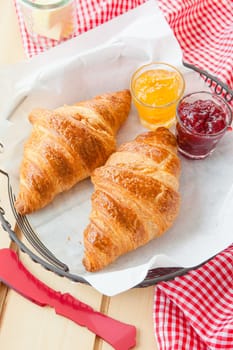 Fresh croissants with jams for breakfast