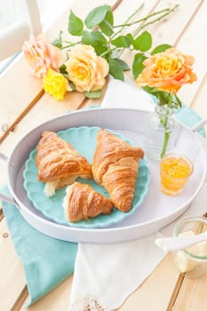 Fresh croissants with jams for breakfast