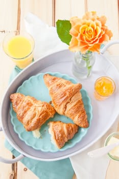 Fresh croissants with jams for breakfast