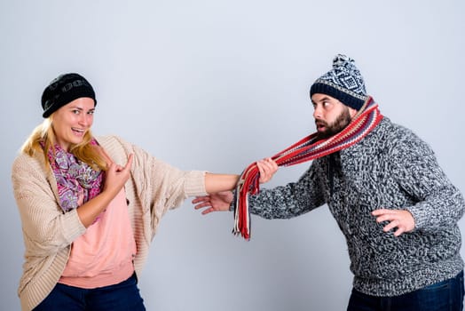 young man and woman in winter dress joking